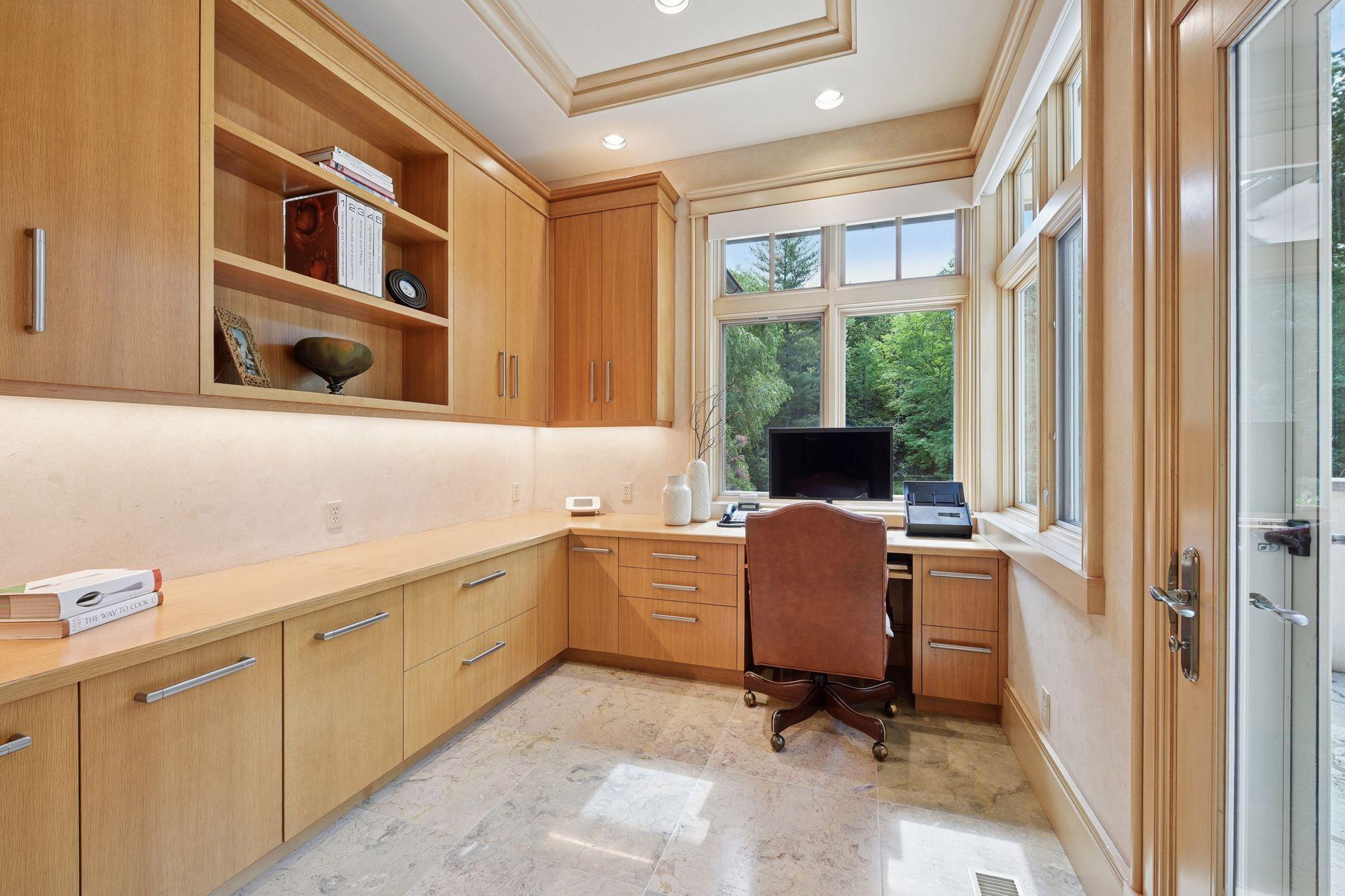 Main level working office with access to patio.