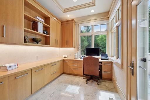 Main level working office with access to patio.