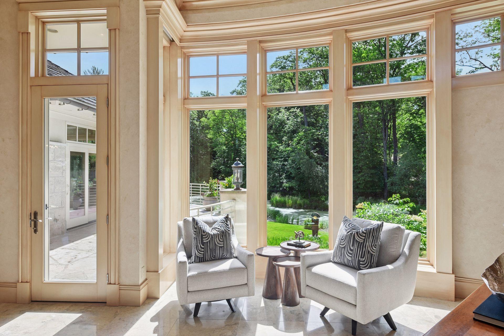 Sunny sitting area adjacent to the great room and site lines to kitchen and foyer.