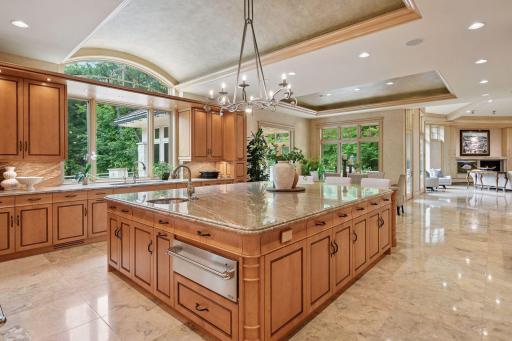 Beautiful cabinetry and generous countertop space provide versatile storage in a stunning setting.