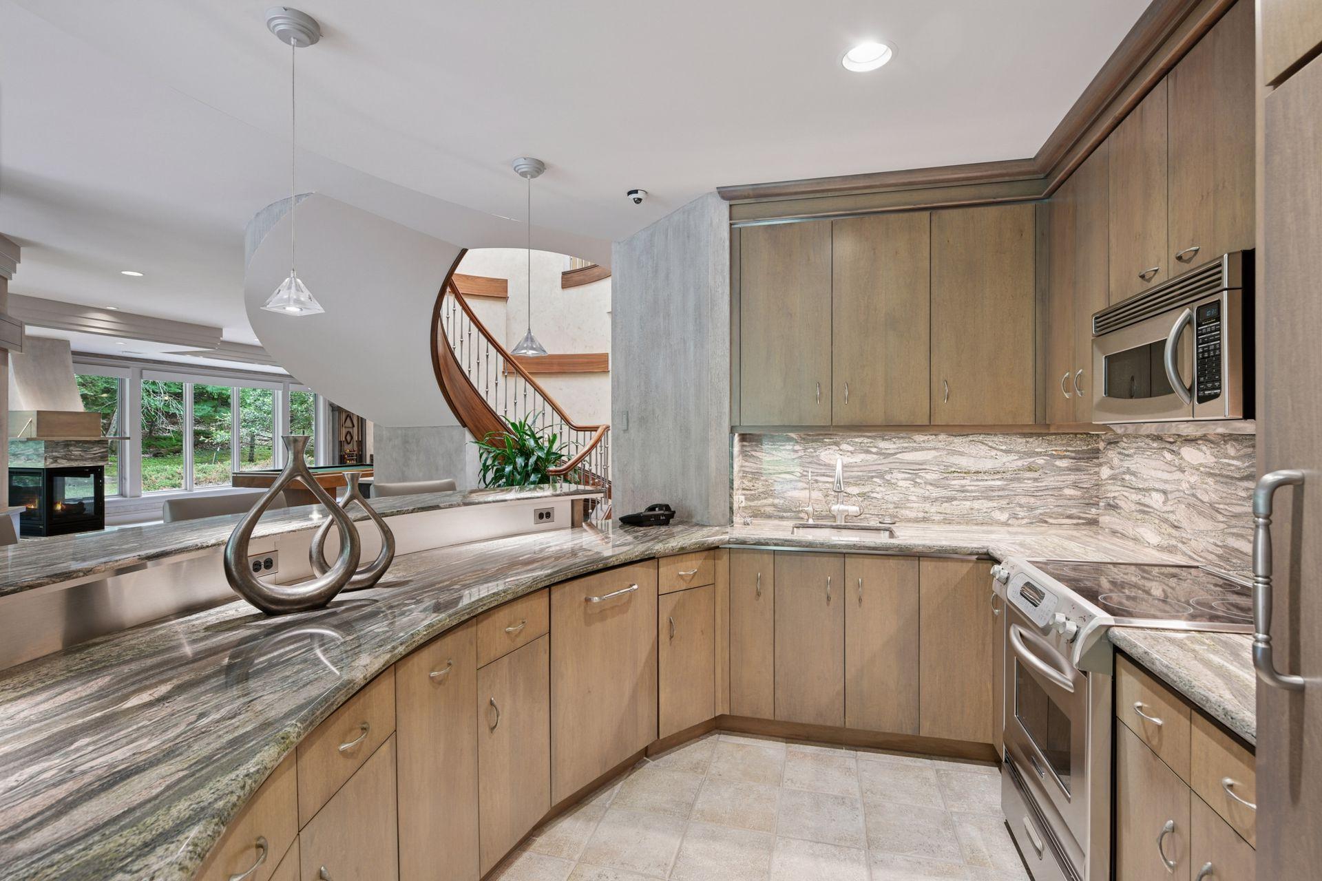 Gorgeous lower-level bar that doubles as a complete kitchen, offering exceptional versatility.