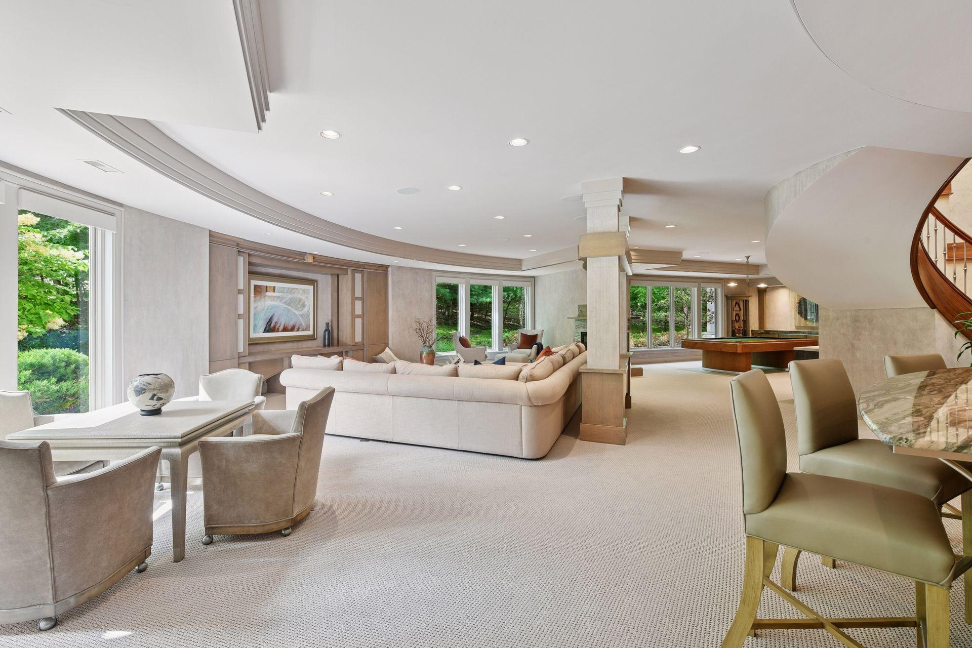 Entertainment space with sightlines from the movie area to the game table and billiards play — easily accommodates large groups while still feeling cozy.