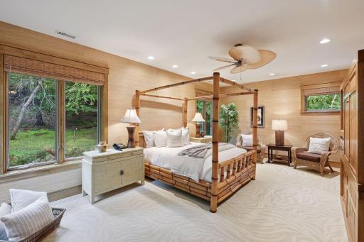 Beautiful bedroom with a walk-in closet; the stylish motif carries seamlessly into the adjoining 3/4 bath.