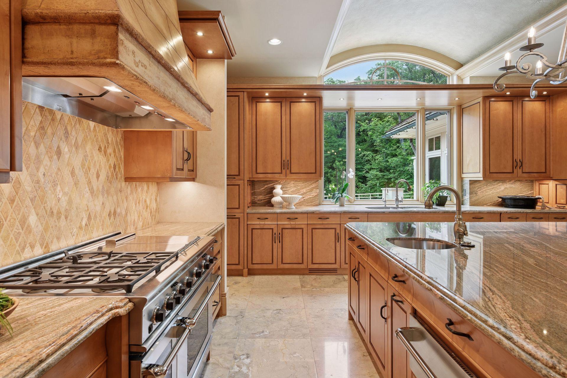 DCS appliances, including double ovens and a gas range with griddle and grill and a convenient warming drawer.