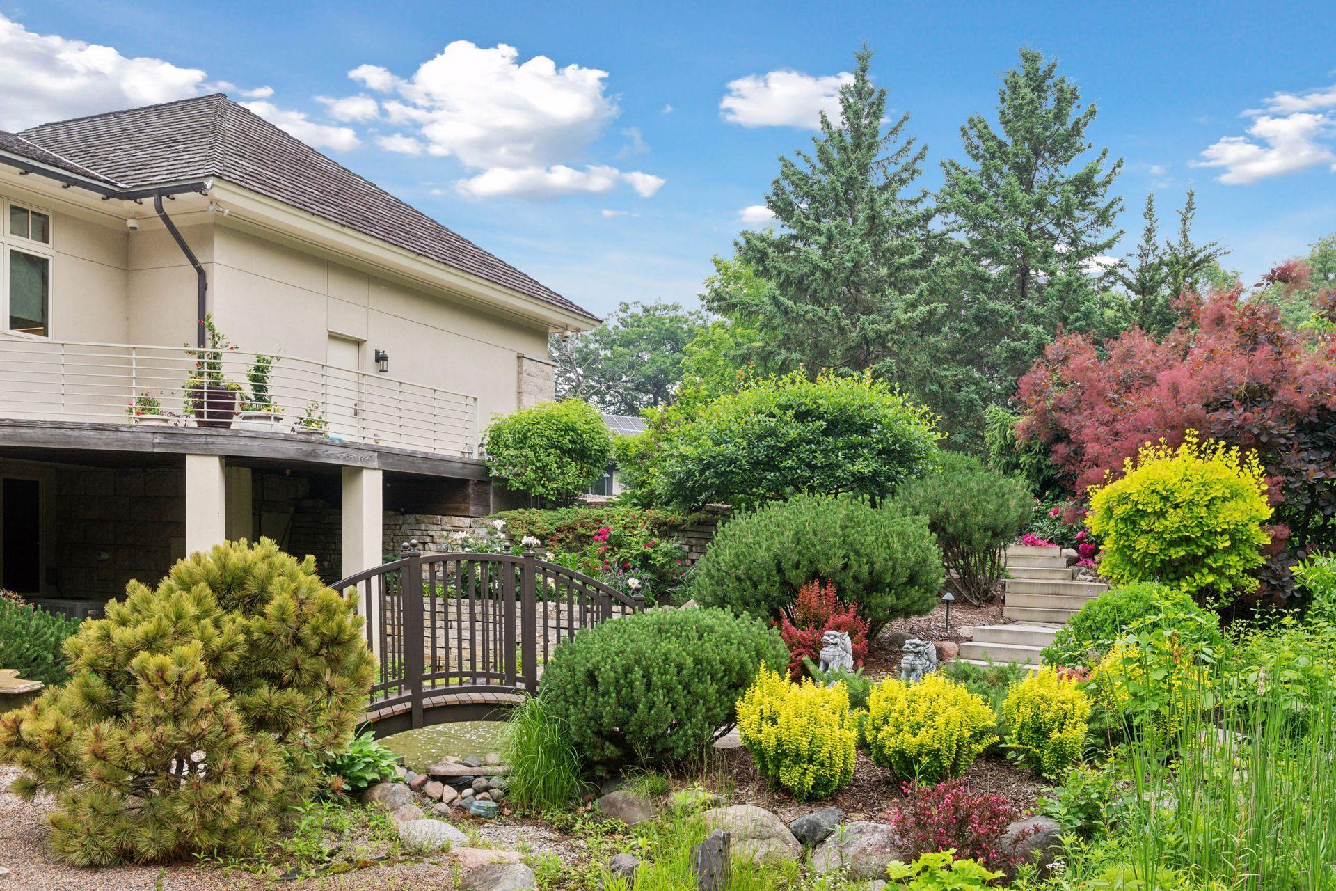 Beautiful landscaping with perennial flowers and bushes that create a riot of color every season.