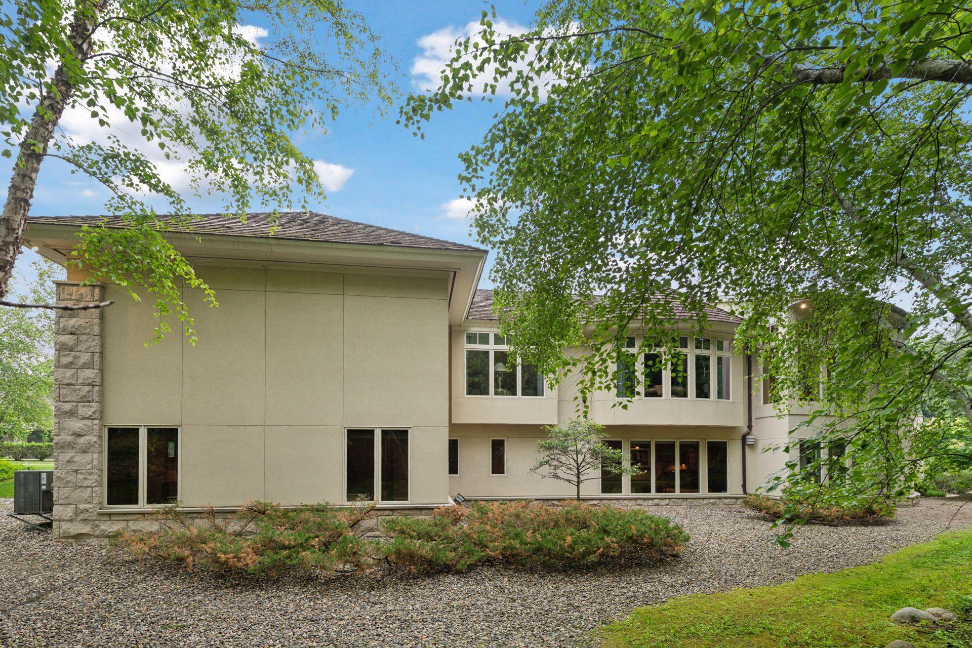 West side of home faces mature trees.