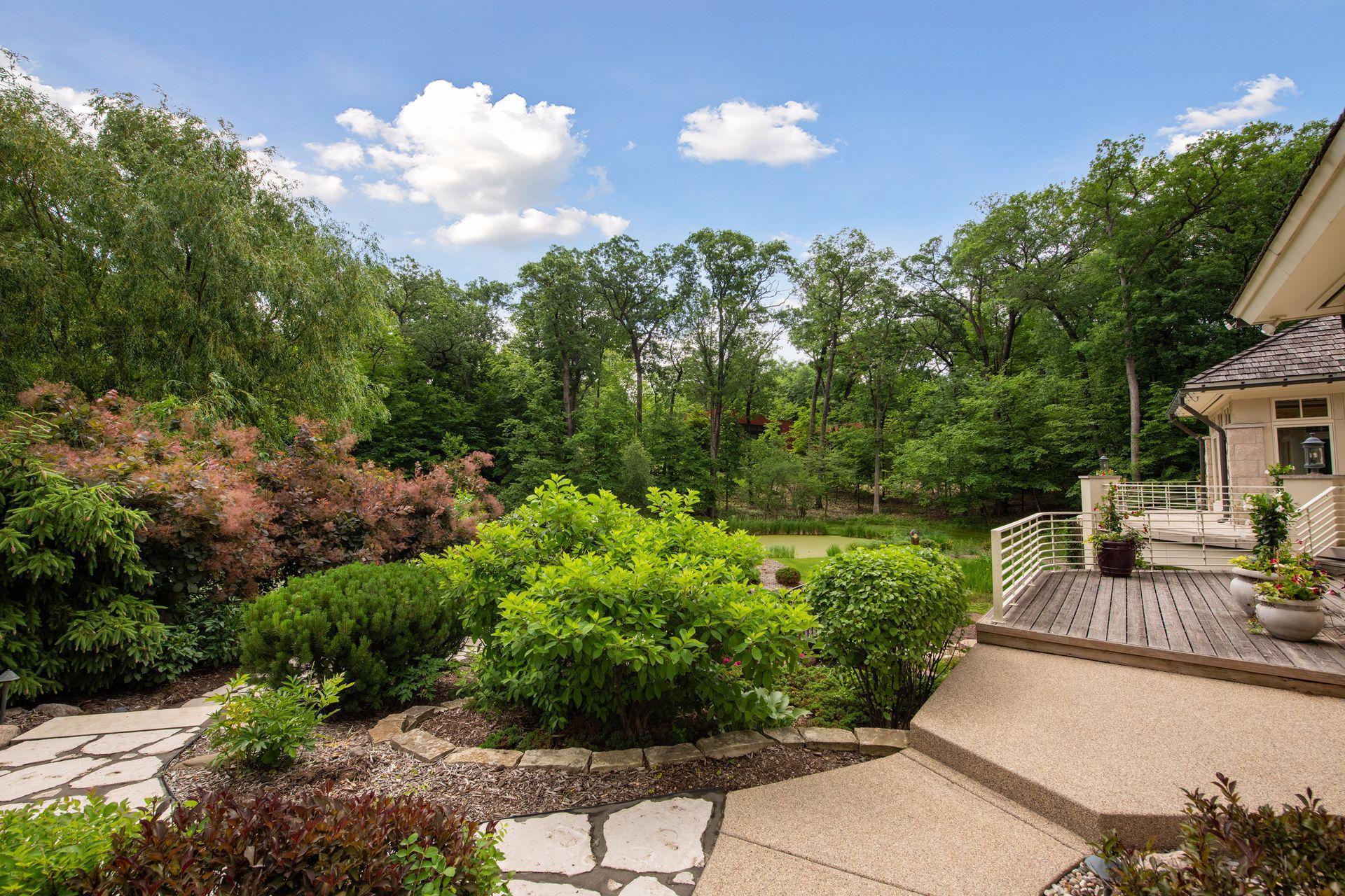 Beautiful landscaping on East side yard. Perennials include a collection of Peonies.