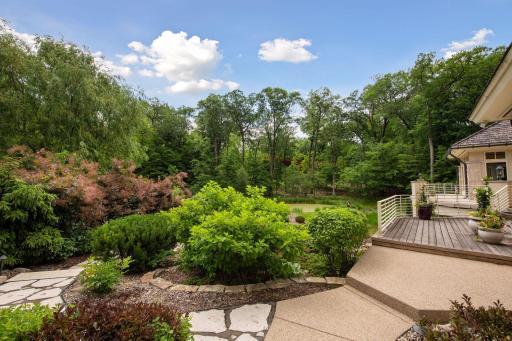 Beautiful landscaping on East side yard. Perennials include a collection of Peonies.
