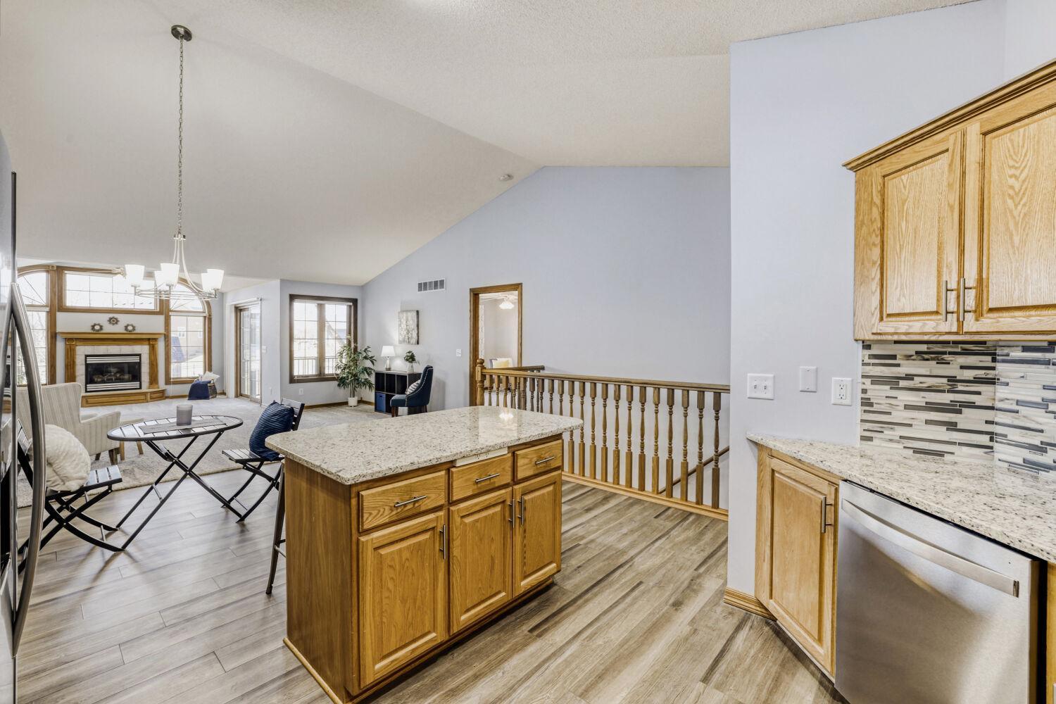 Center island is great for food preparation or entertaining. Right off the kitchen is the stairs leading to the lower level.