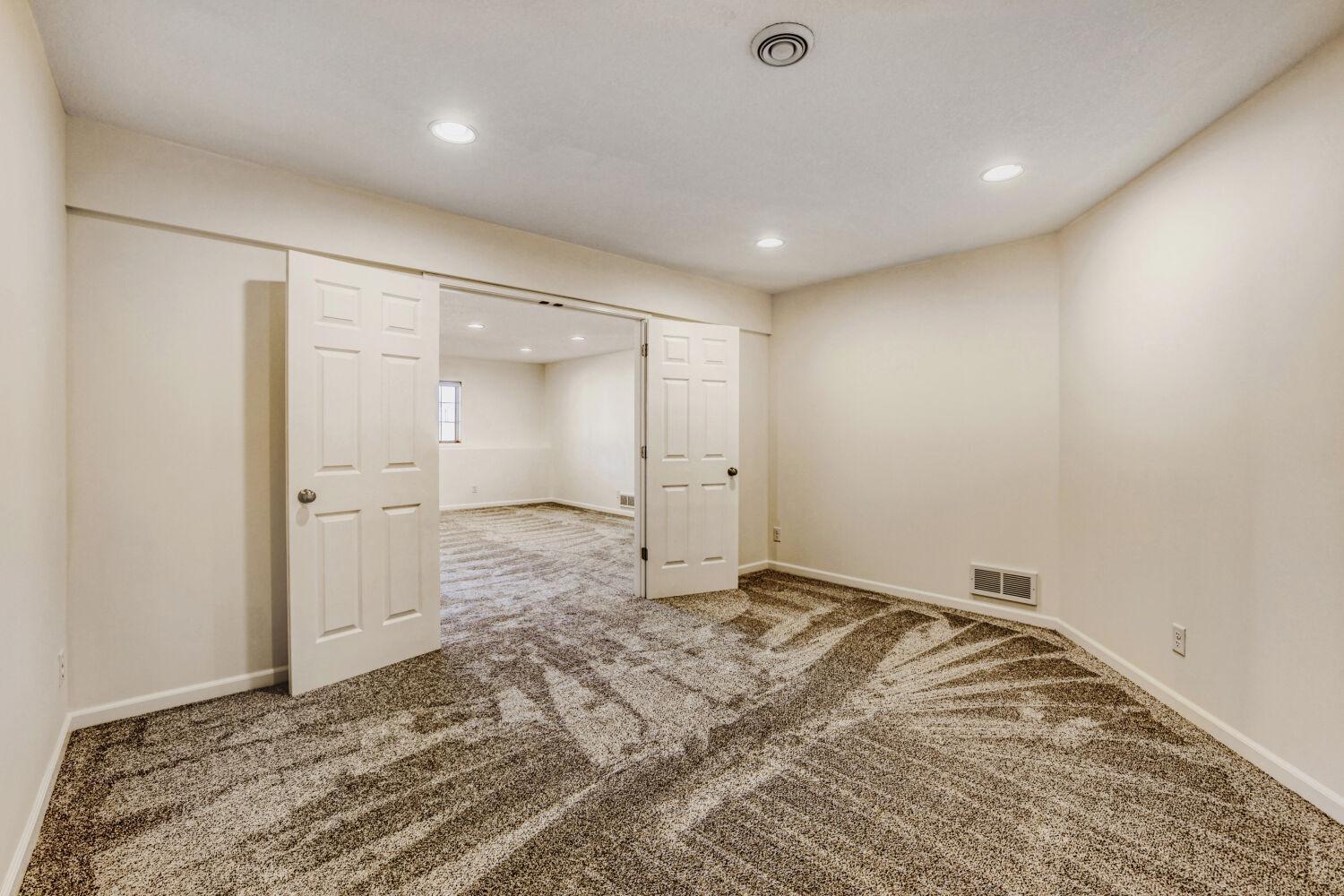 The bonus room looking into the family room. Close the double doors for privacy.