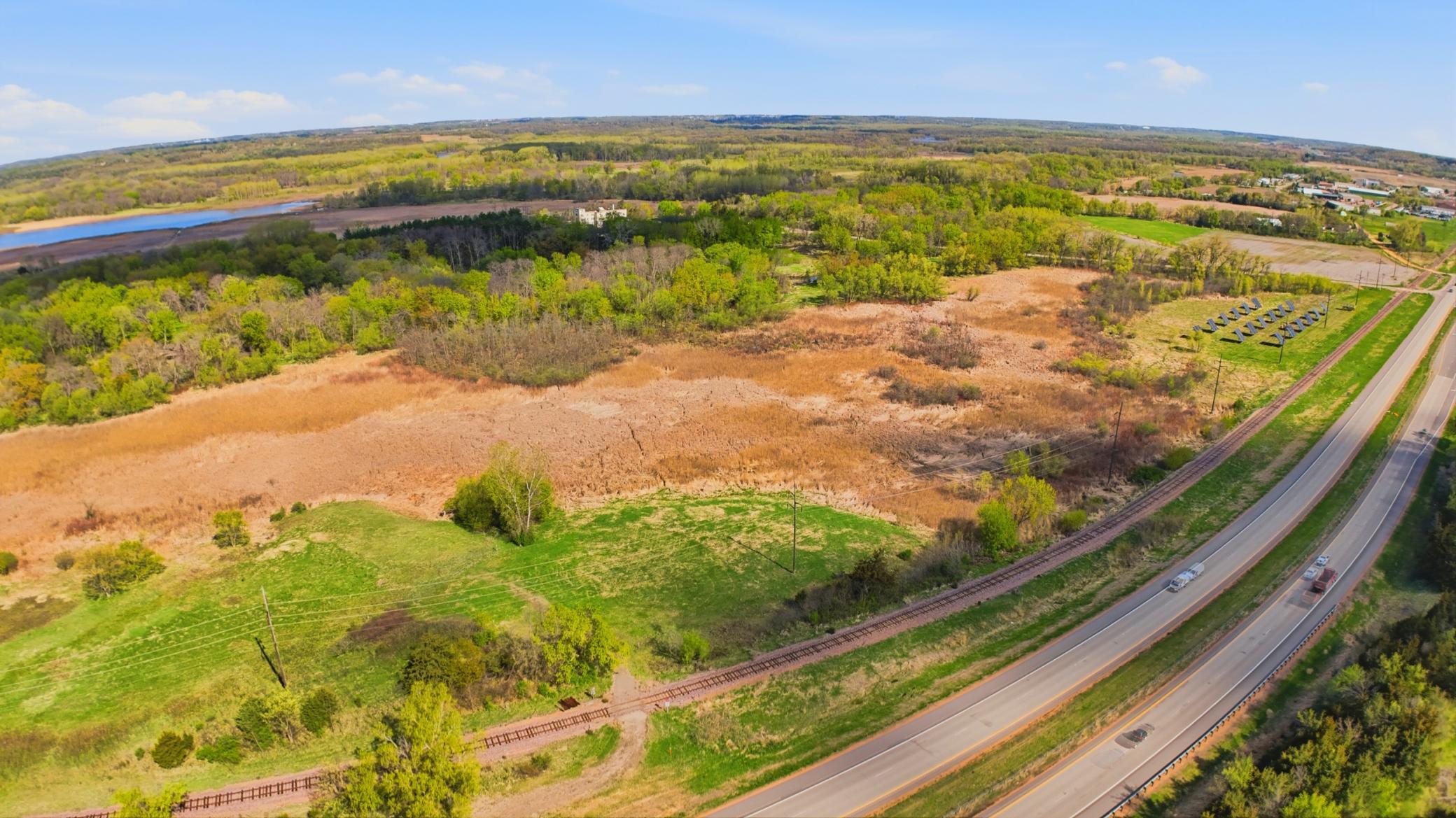 3.5 acres across Hwy. 169 is included
