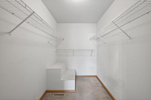Large Closet in Primary Bedroom with lots of hanging and storage space.