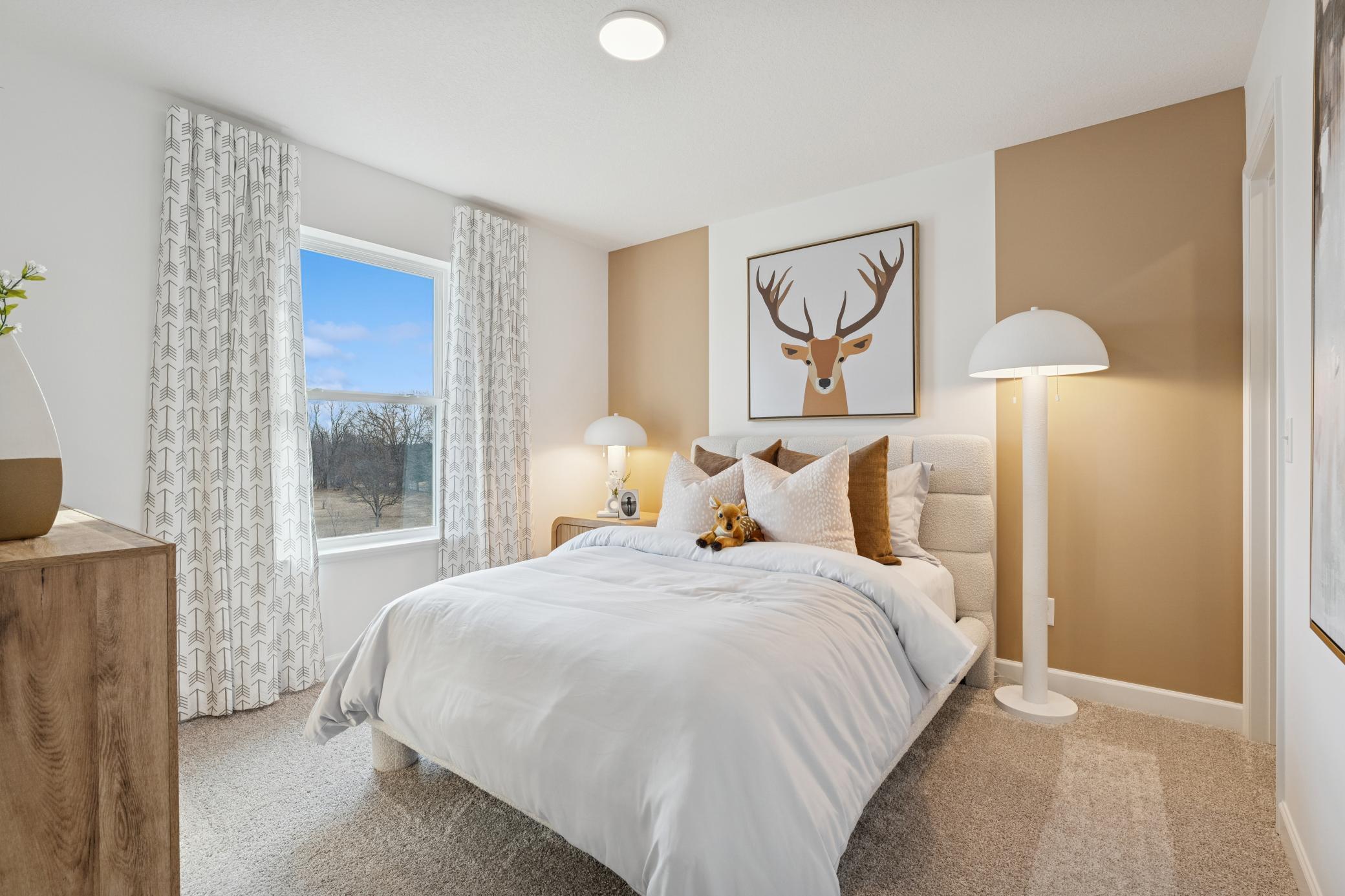 (Photo of a decorated model, actual homes finishes will vary) A third secondary bedrooms that comes perfectly sized with a spacious closet.