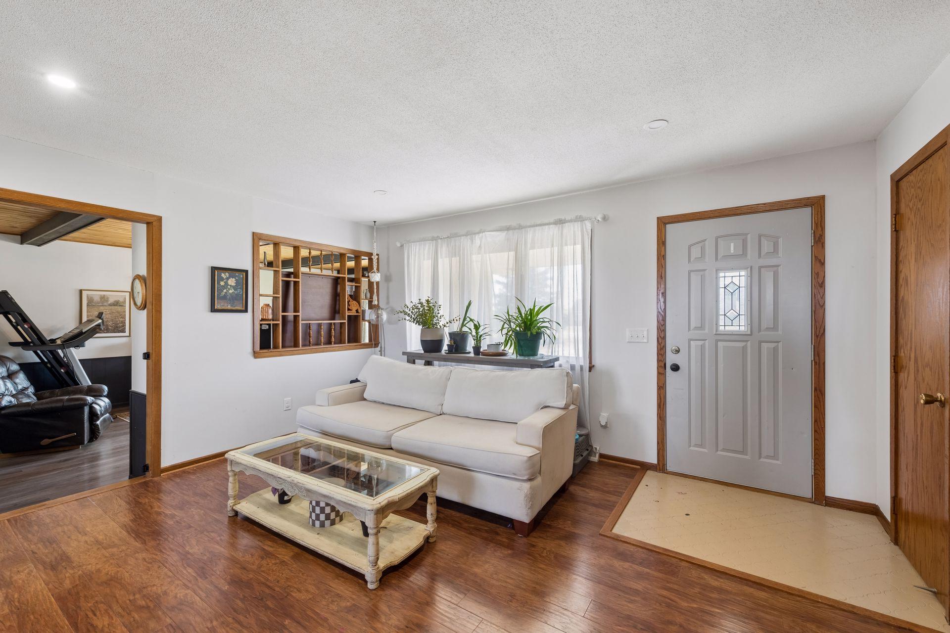 Living room is adjacent to spacious main level family room. - 0017.jpg