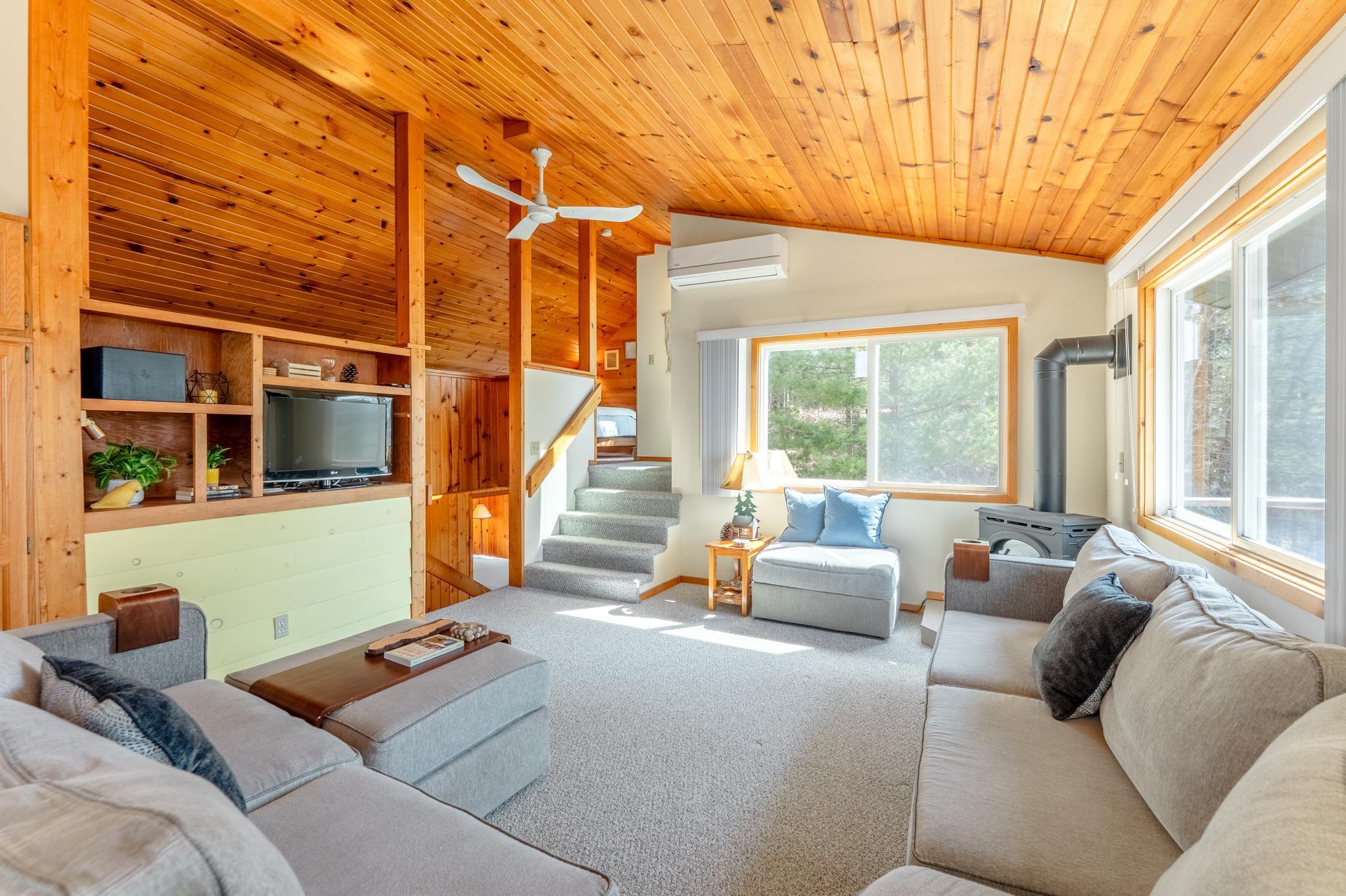 The living room is the perfect gathering place. Spacious and cozy at the same time.