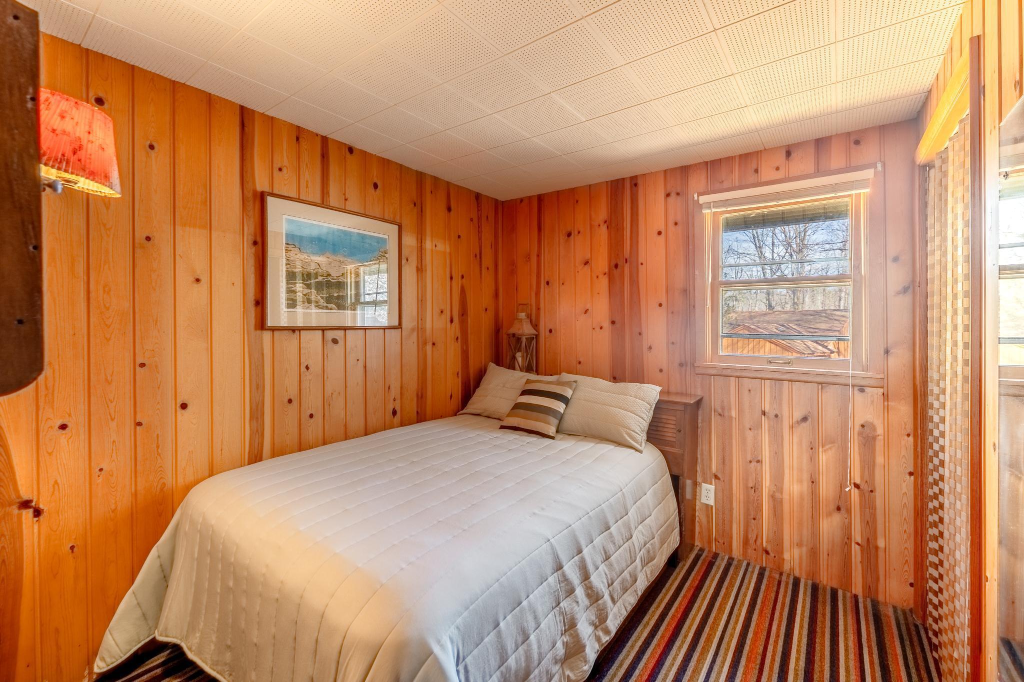 Second bedroom with classic knotty pine.