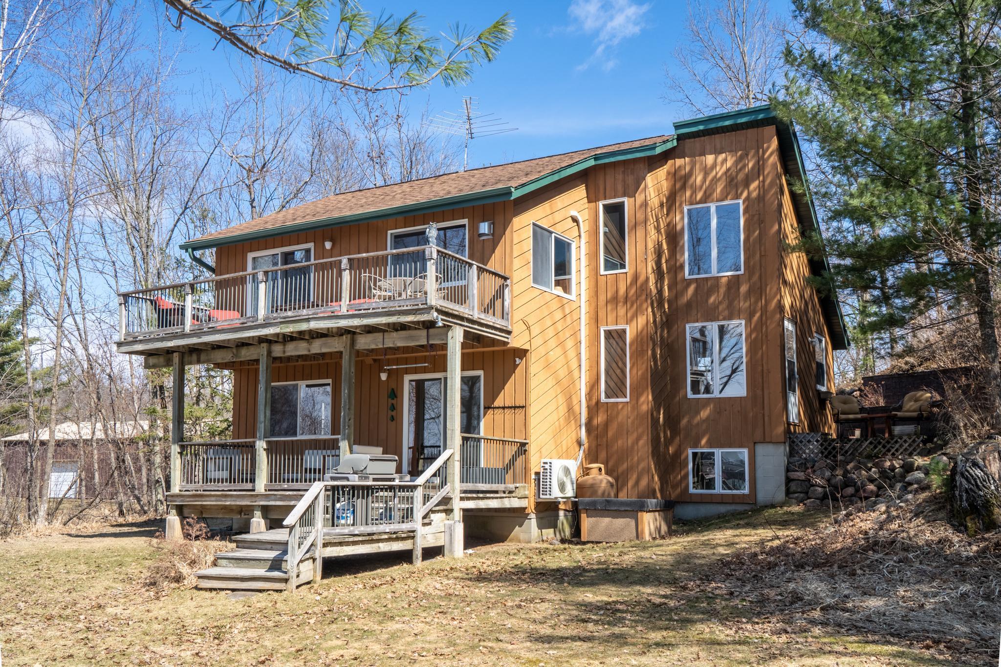 Walk out to the lake, chill on the lower covered deck or dine al fresco with amazing views of Bone Lake and Bald Eagle Island.