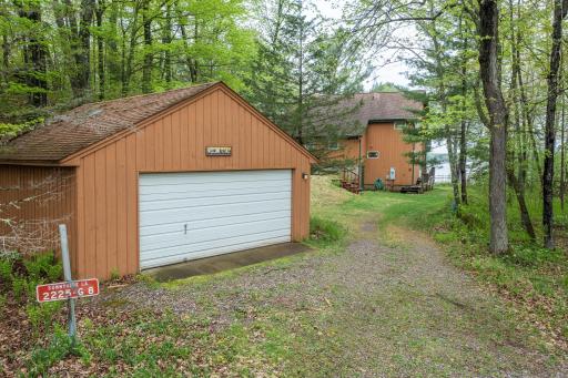Expansive two-car garage with attached workshop.