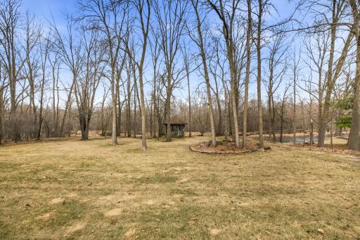 Spacious Wooded Setting Makes This Backyard The Place To Be! Sit A Spell In The Gazebo With Amazing Views Of The River!!