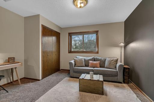 A tastefully Painted Space With A Modern Aesthetic. Currently Serving As A Comfortable Sitting Room, This Area Presents A Great Possibility For Bedroom, Offering Flexible Living Options.