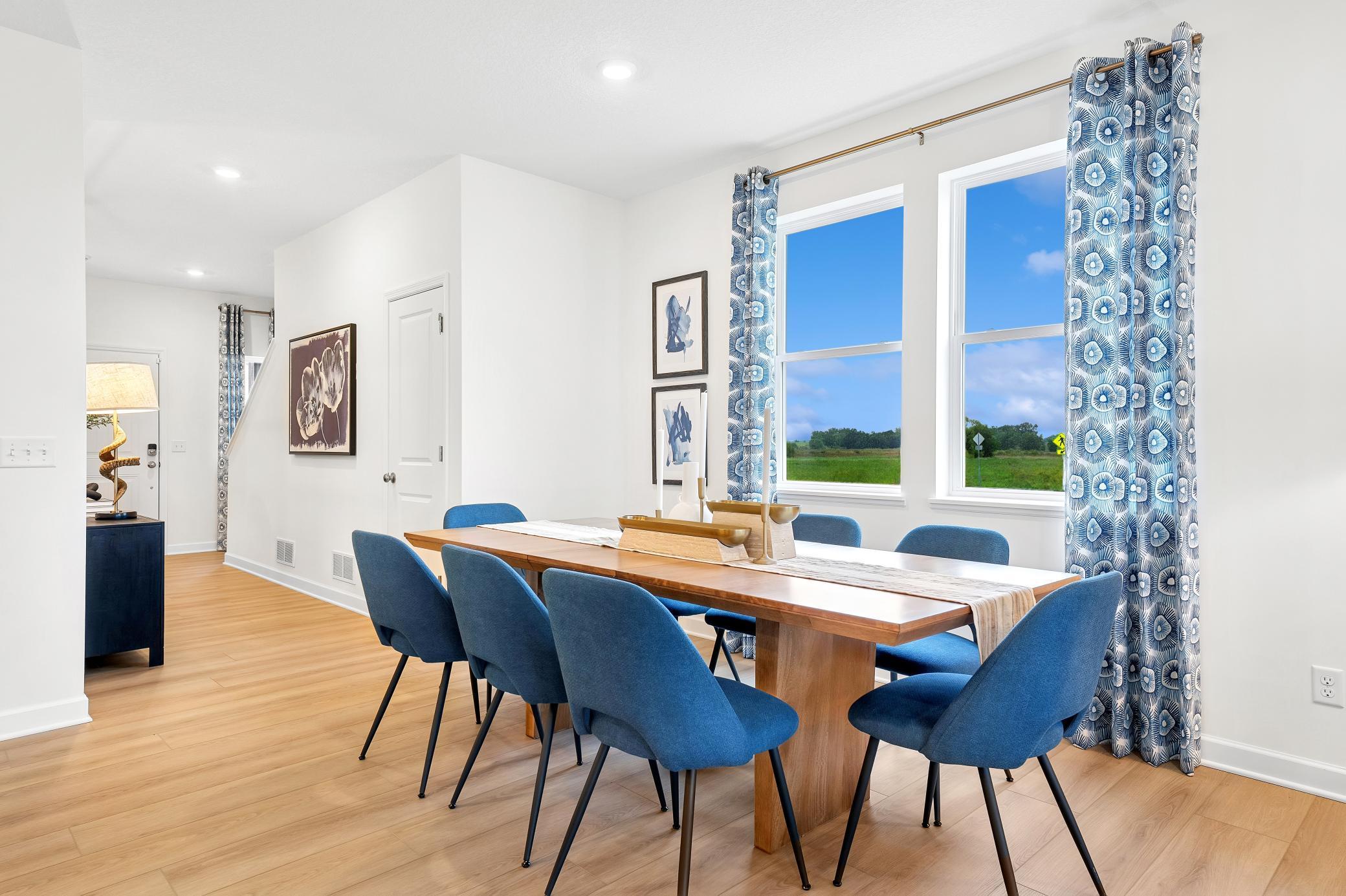 (Photo of a decorated model, actual homes finishes will vary) The dining area.