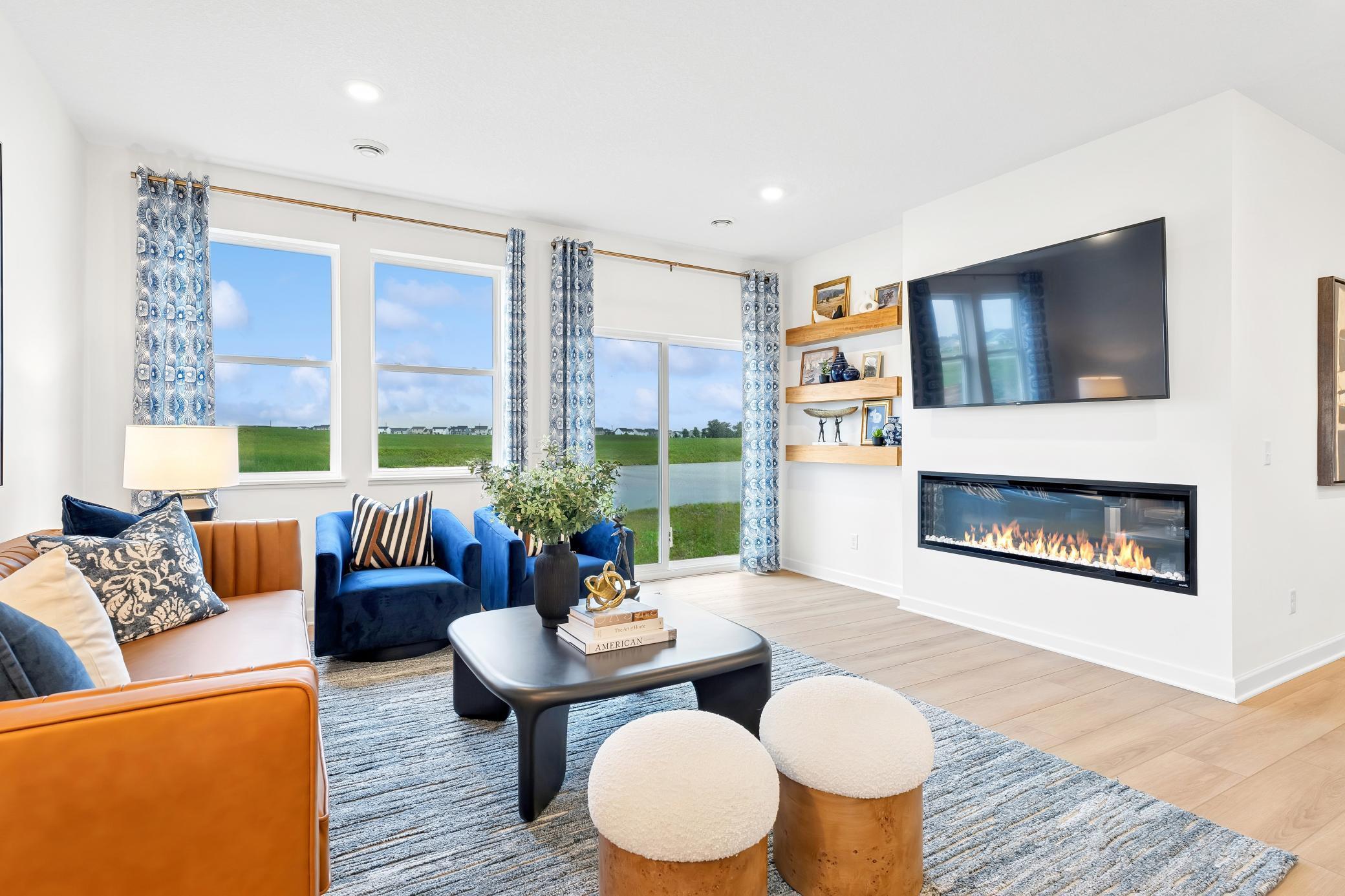 (Photo of a decorated model, actual homes finishes will vary) Located at the back of the home, the Great Room is just as cozy as it is spacious, providing a natural gathering space within the home.