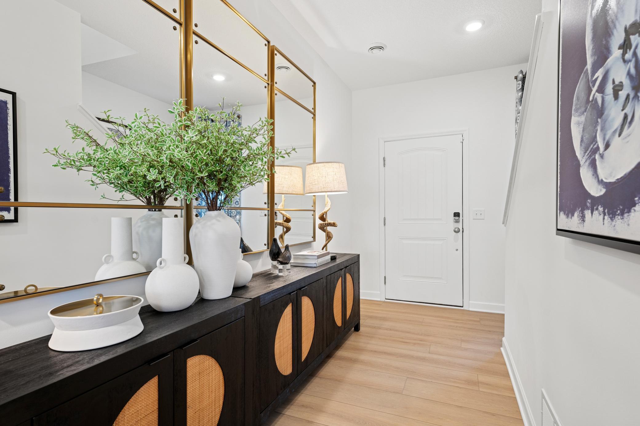 (Photo of a decorated model, actual homes finishes will vary) Make the best first impression with this bright and open foyer!