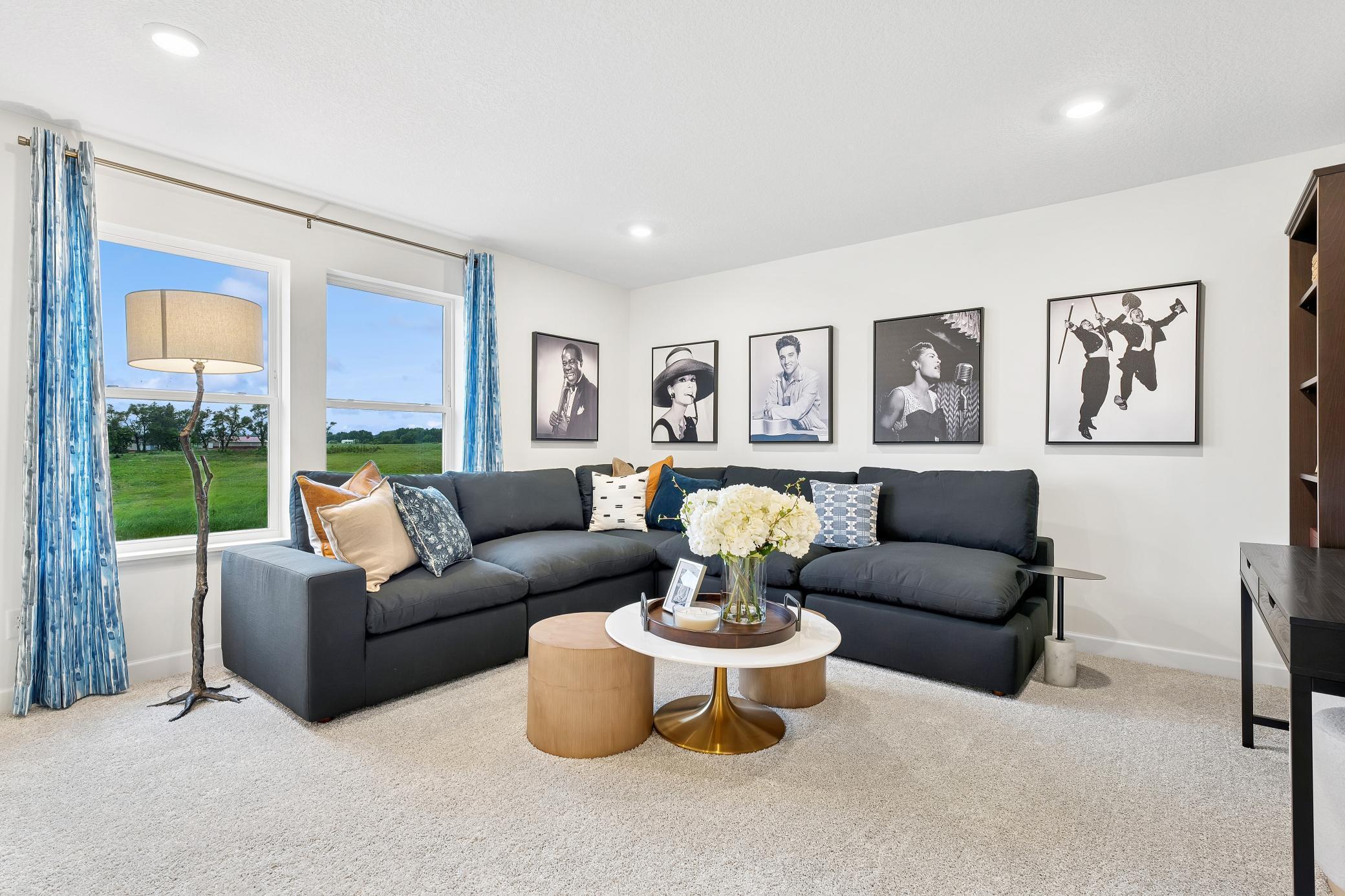 (Photo of a decorated model, actual homes finishes will vary) A loft found upstairs provides additional shared living space that the whole family will enjoy.