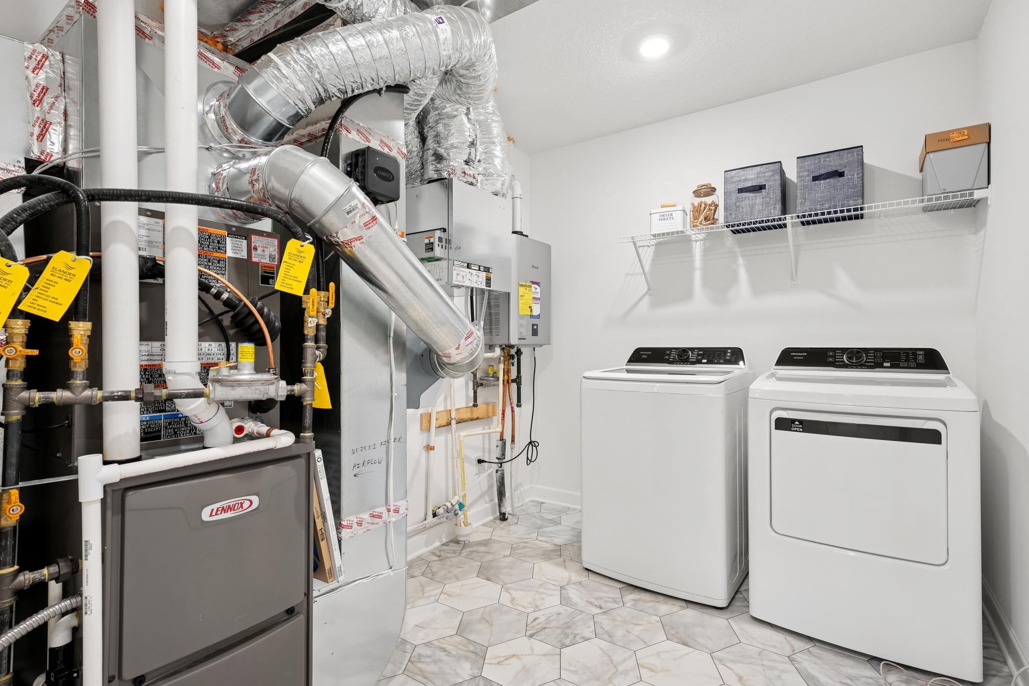 (Photo of a decorated model, actual homes finishes will vary) The laundry room.