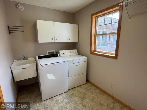 Main floor laundry between the garage and kitchen