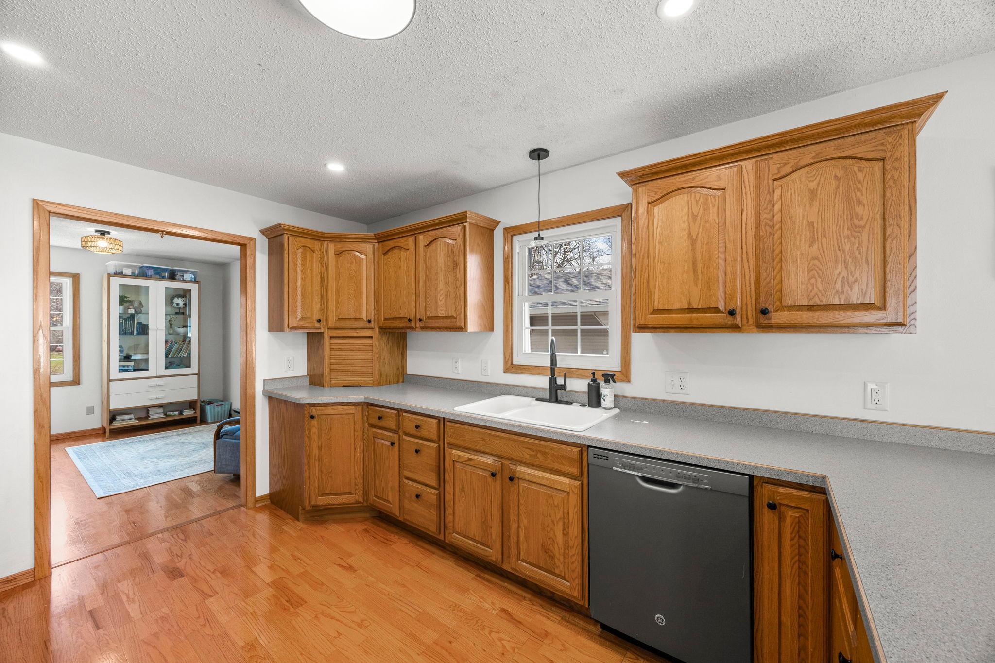 The kitchen offers plenty of cabinetry for storage!