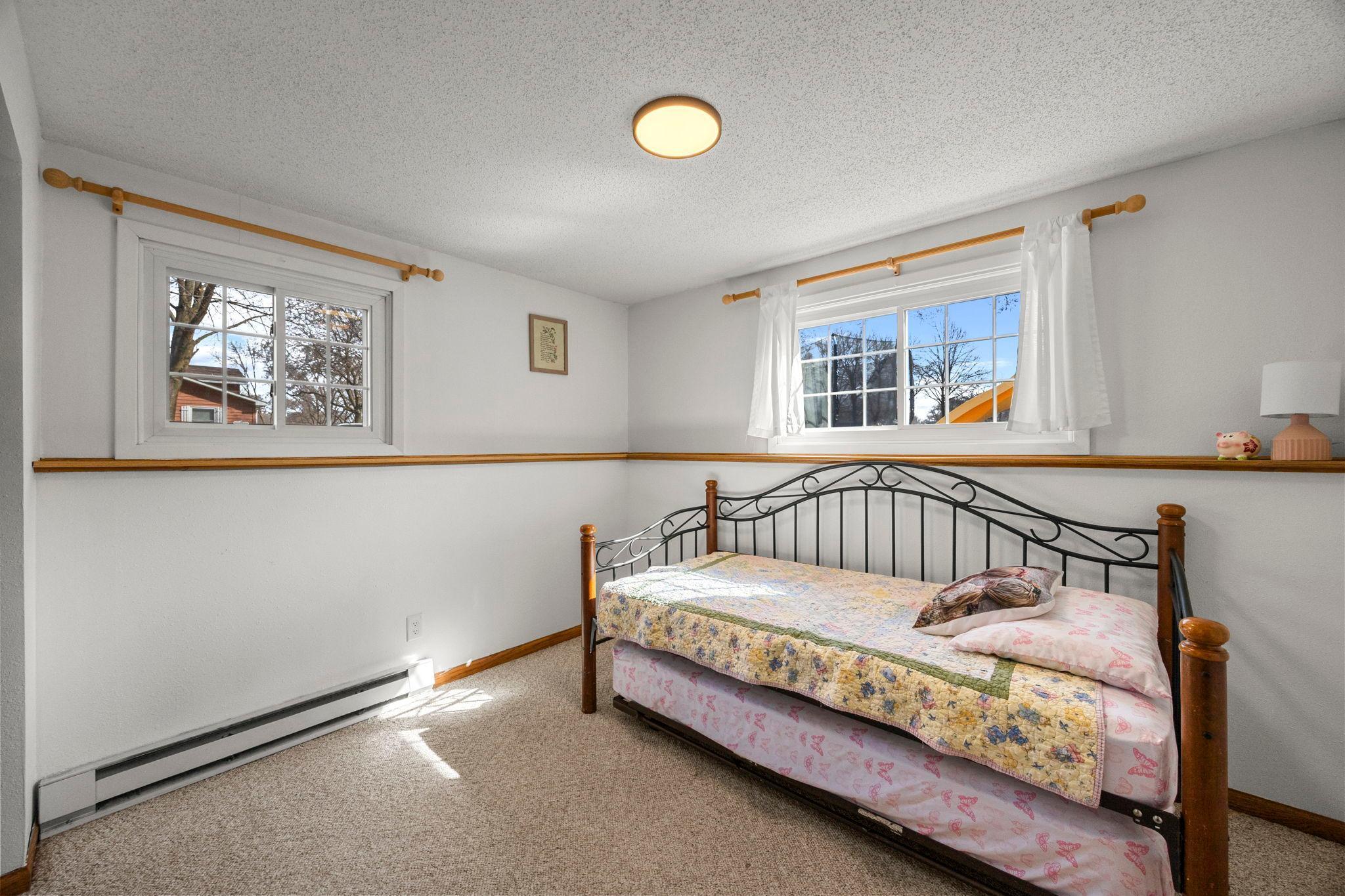 Two additional bedrooms are also located on this level.