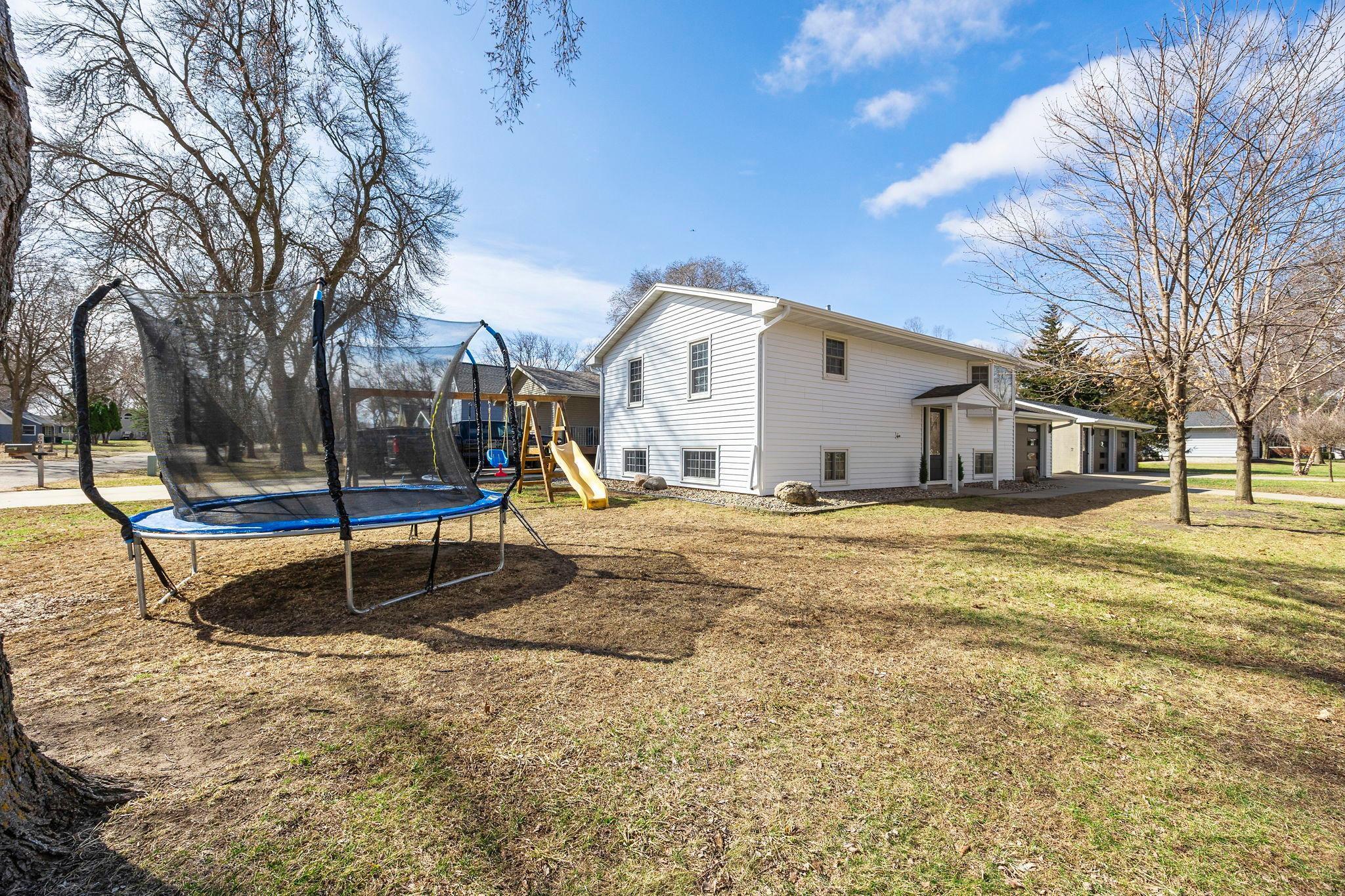 Enjoy the outdoors in the spacious corner lot with mature trees.