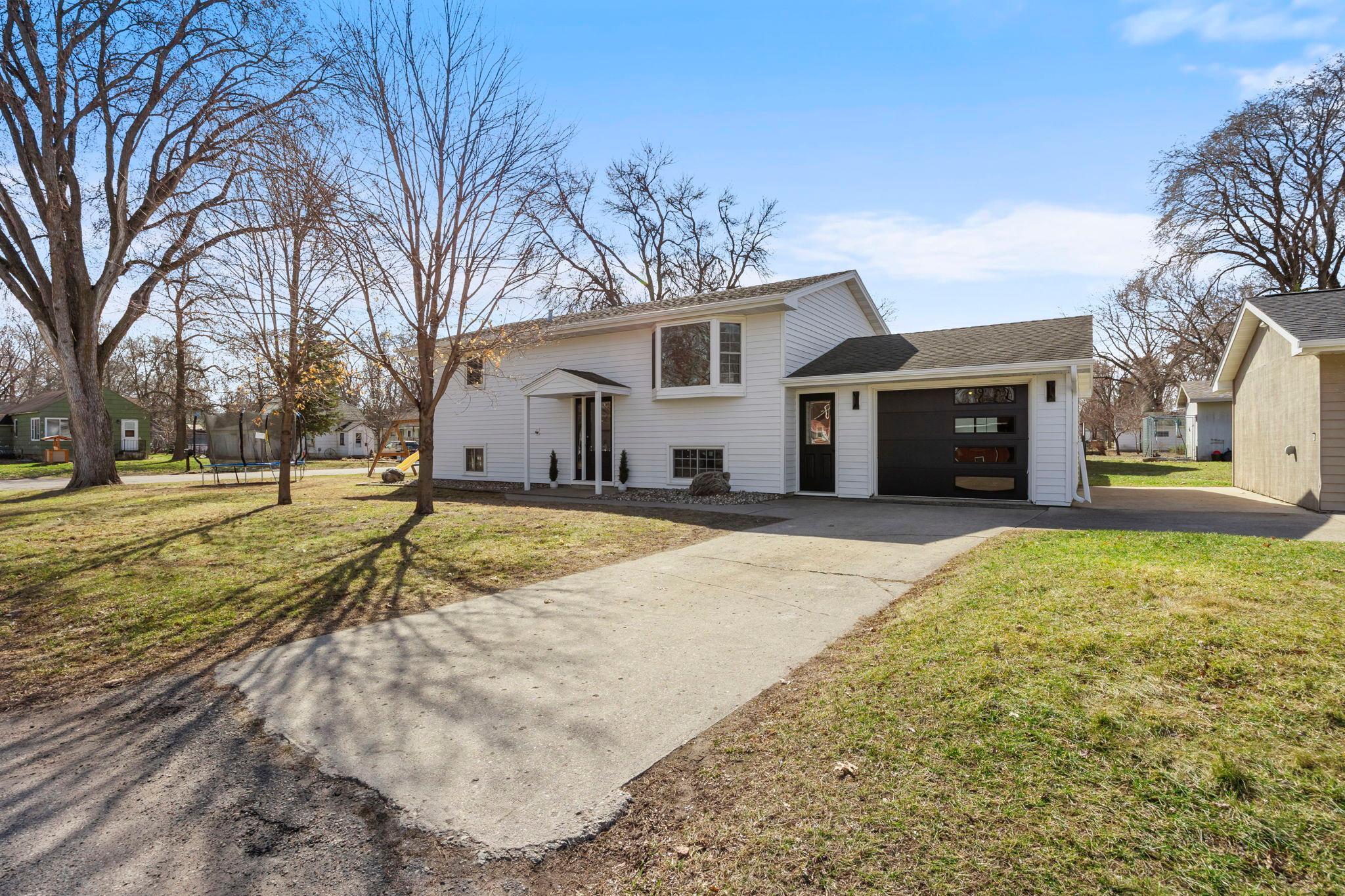 Recent updates include new exterior doors on the home and garage (2025), new garage doors (2026), new siding (February 2026), and a new garage roof (2026)!