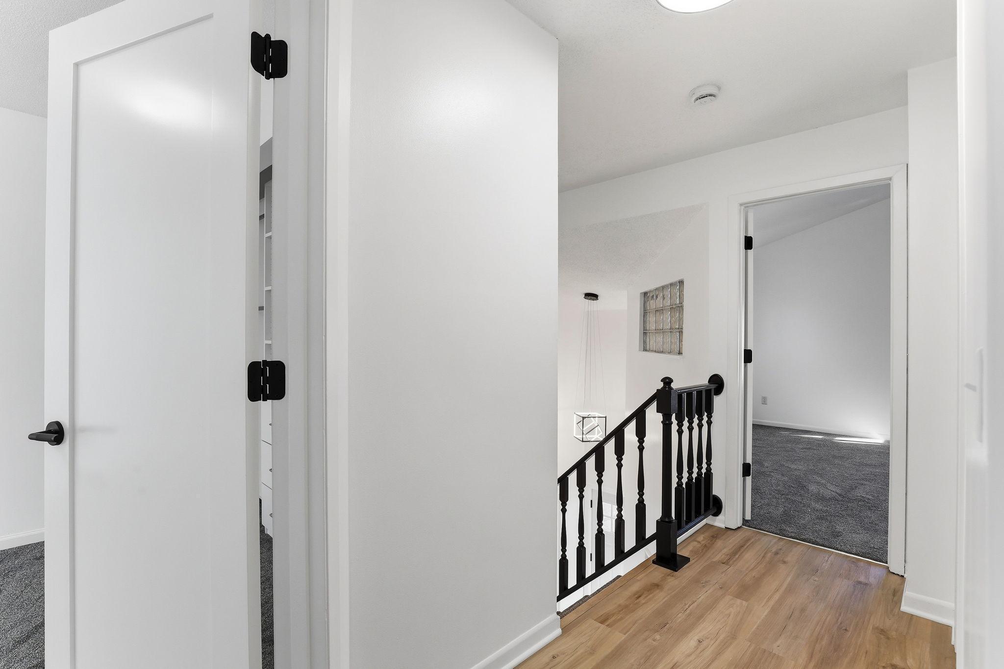 Light and open hallway that ties the upper level together