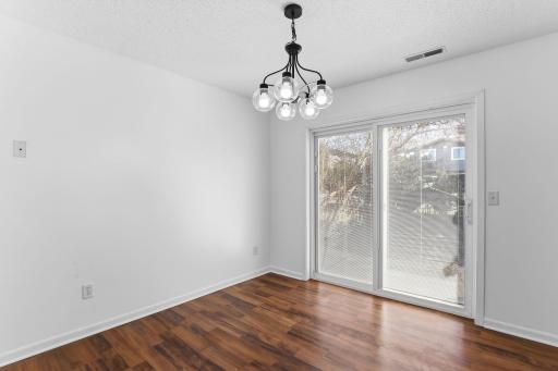 Enjoy easy indoor-outdoor living with a sliding door that opens to a cozy patio—ideal for morning coffee or evening gatherings