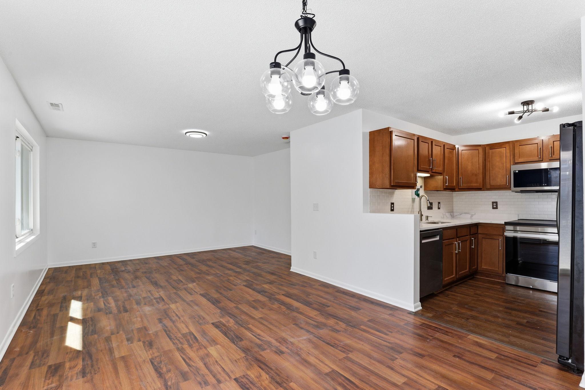 Seamless flow between kitchen, dining, and living spaces