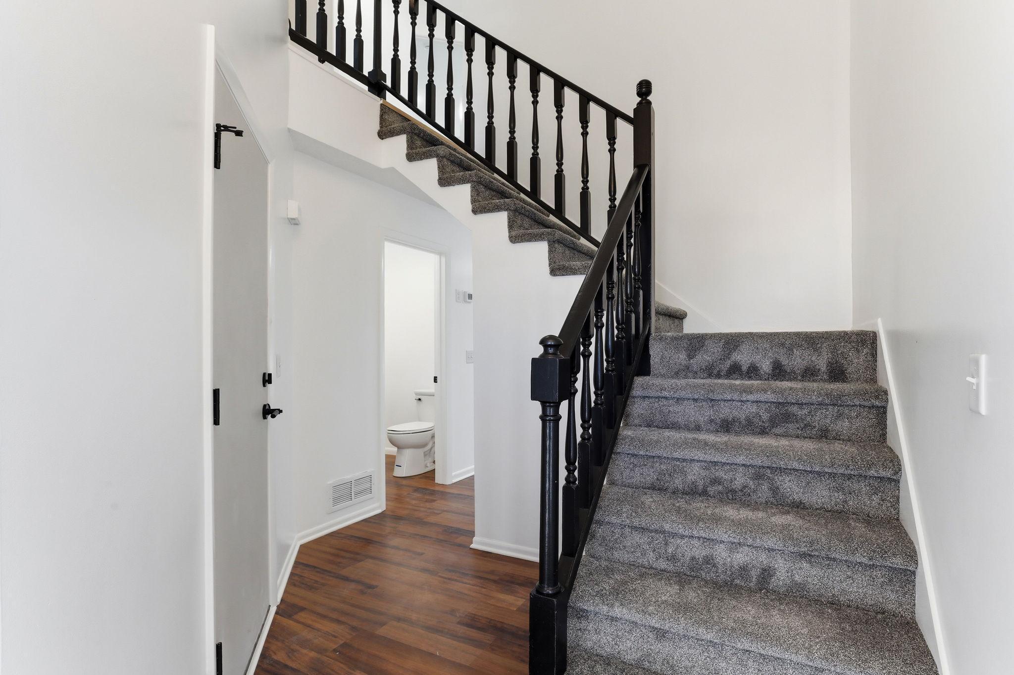 Freshly updated from the moment you walk in—new flooring, new carpet, fresh paint, and updated lighting throughout