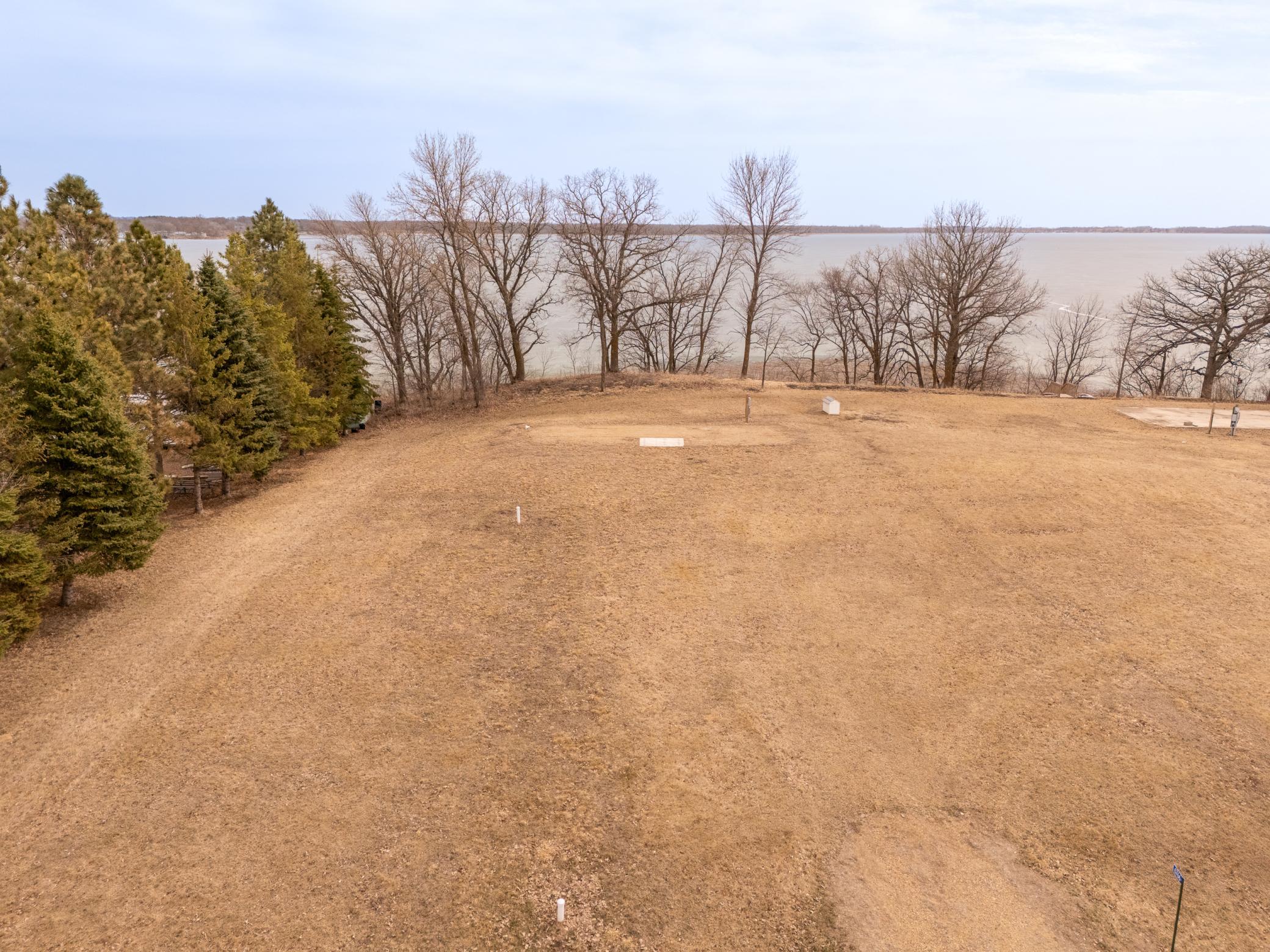 .49 Ac Lot with electric, city sewer, well and RV Pad.
