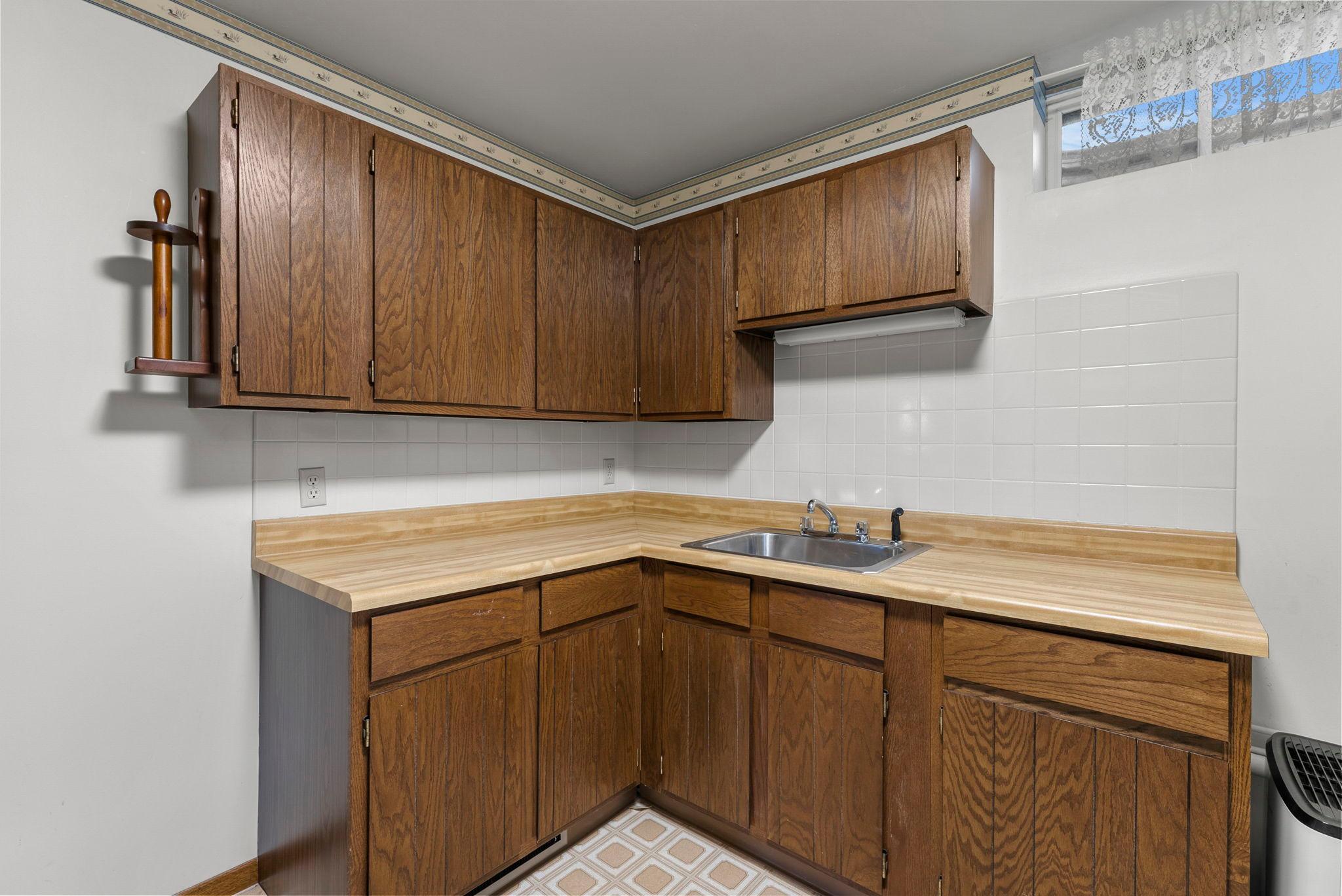 Laundry room storage and folding space and sink