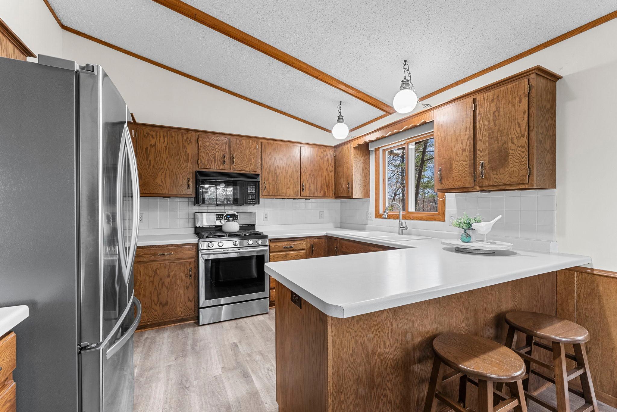 Well appointed kitchen with stainless steel appliances