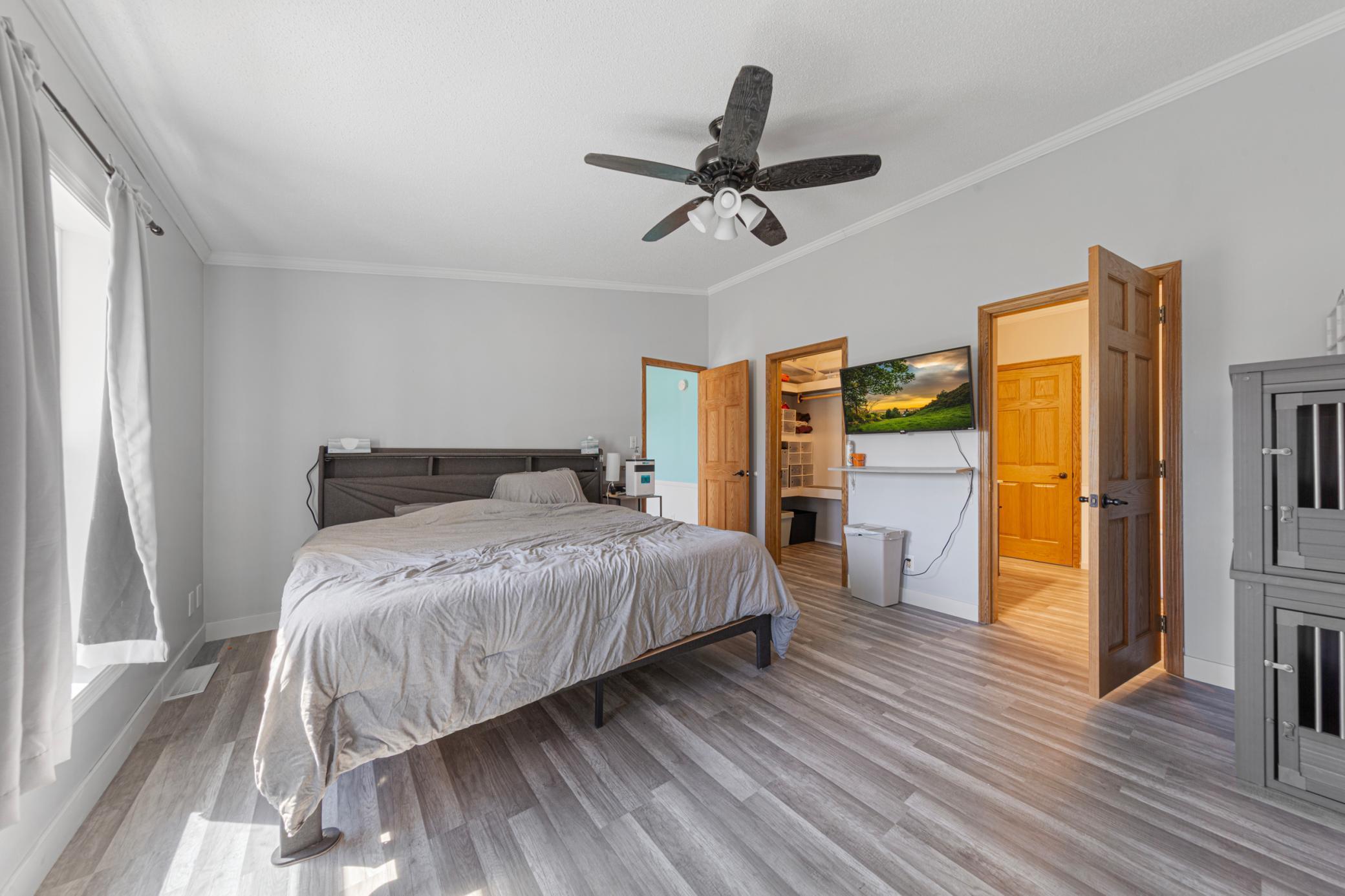 Primary bedroom with crown molding