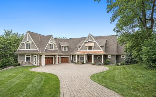 A premier estate offering a 4-car heated garage, nearly 10,000 sqft of living space, and set on nearly one acre