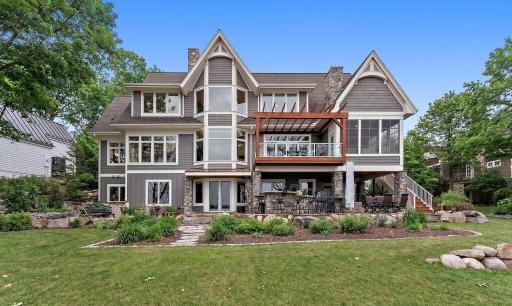 Walkout lower level design seamlessly connects indoor living to outdoor lake life