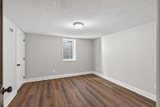 The fourth bedroom, located on the lower level, is ideal for guests, older children, an at home office, and more!