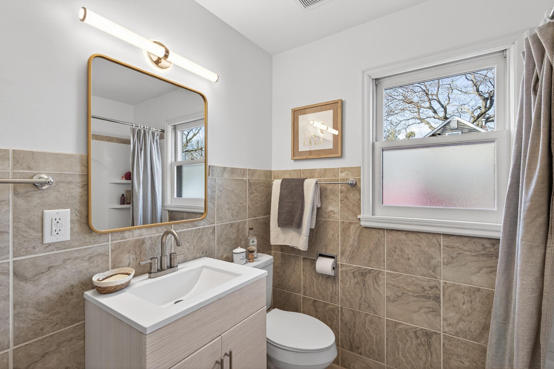 This main floor full bath is convenient to both bedroom and all other living spaces making it ideal for guests and everyday use.