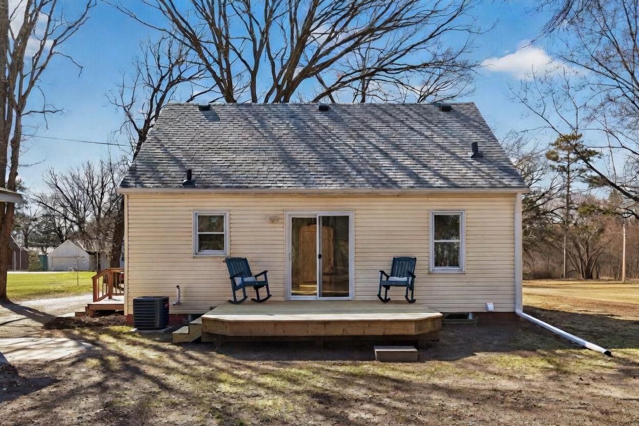 Situated on a .36-acre lot, the property features plenty of green space along with a low deck.