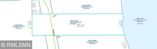 Lot Map - Mostly level with gradual slope to 100 ft lake front. Lot portion to West of Dueholm Drive is currently used for extra parking, but there is enough area to build another garage if desired.