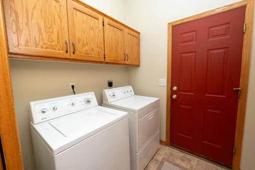 The laundry room, located just off the kitchen, also provides access to the attached two car garage.