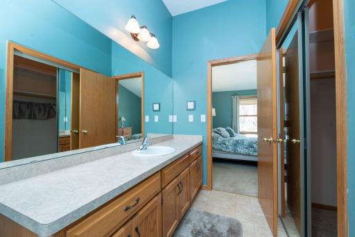 A spacious vanity with plenty of storage and an oversized mirror makes morning routines a breeze!